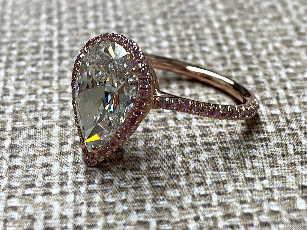 Rose Gold pearshape diamond center ring