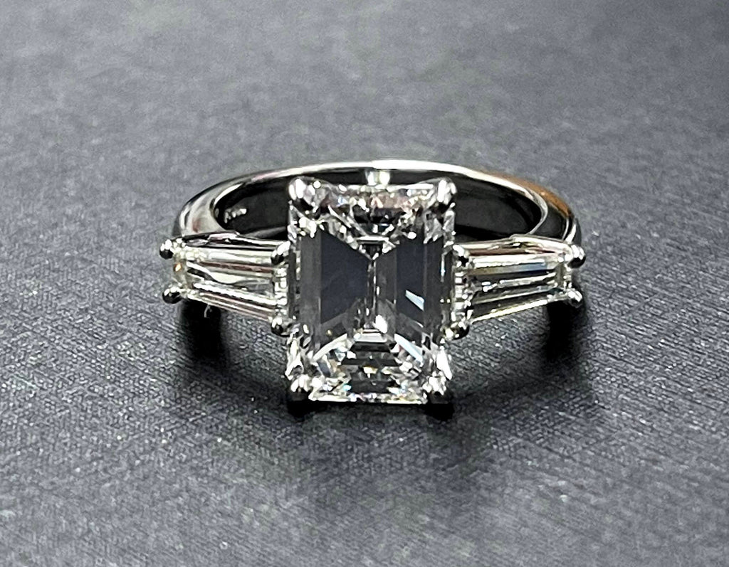 Platinum diamond center baguette sides ring