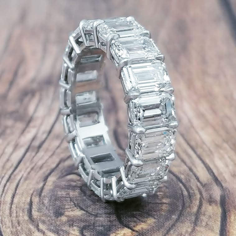 Platinum eternity band with emerald cut diamonds