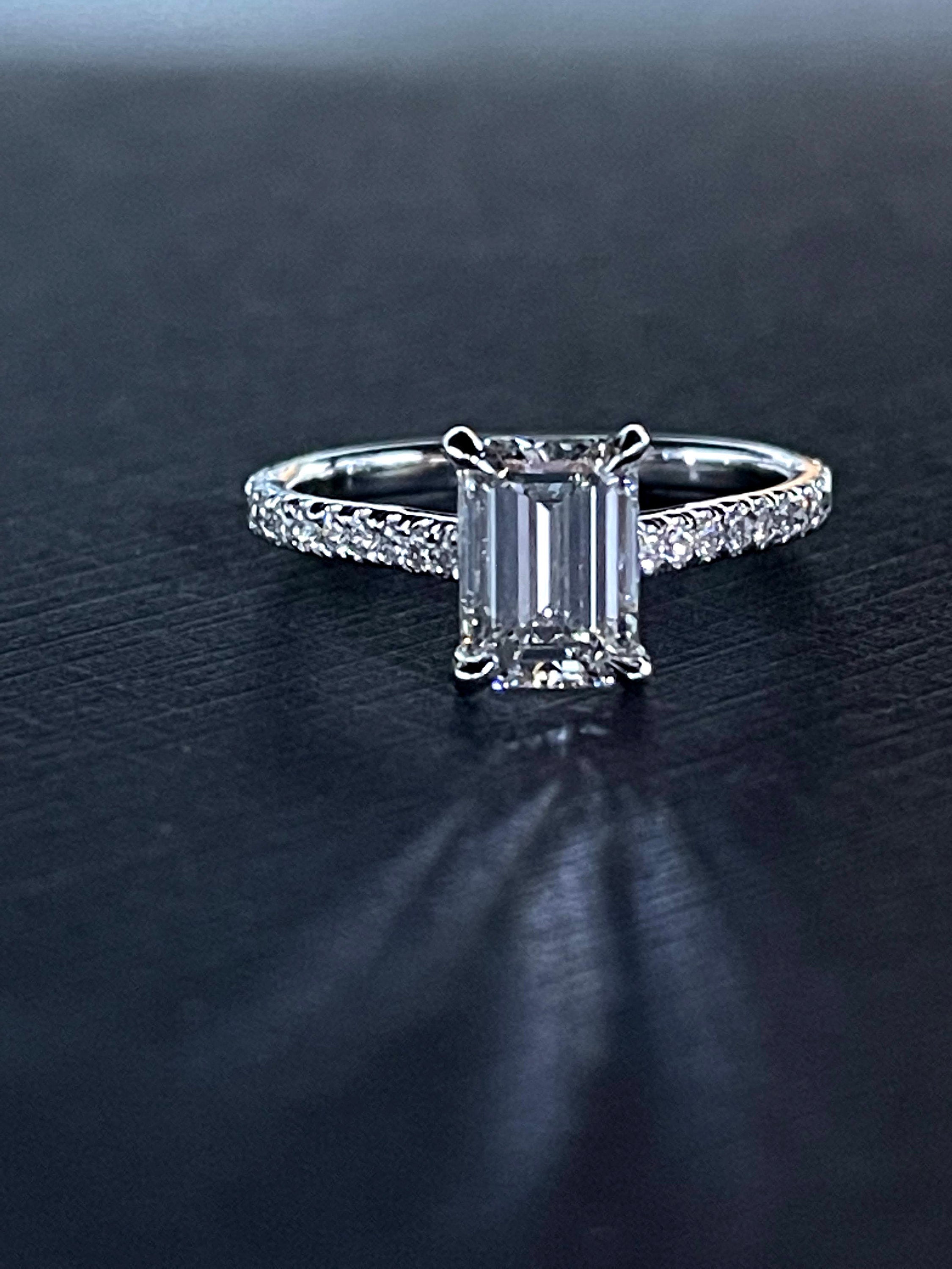 18K white gold emerald cut center diamond ring