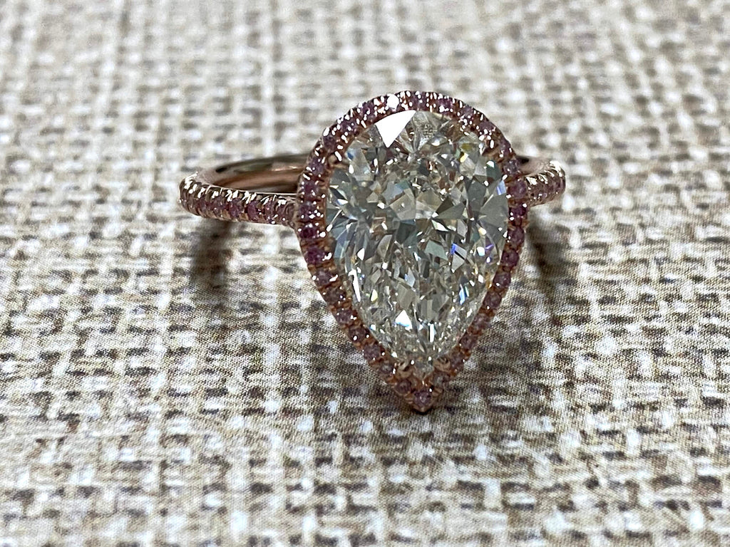 Rose Gold pearshape diamond center ring