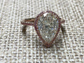 Rose Gold pearshape diamond center ring