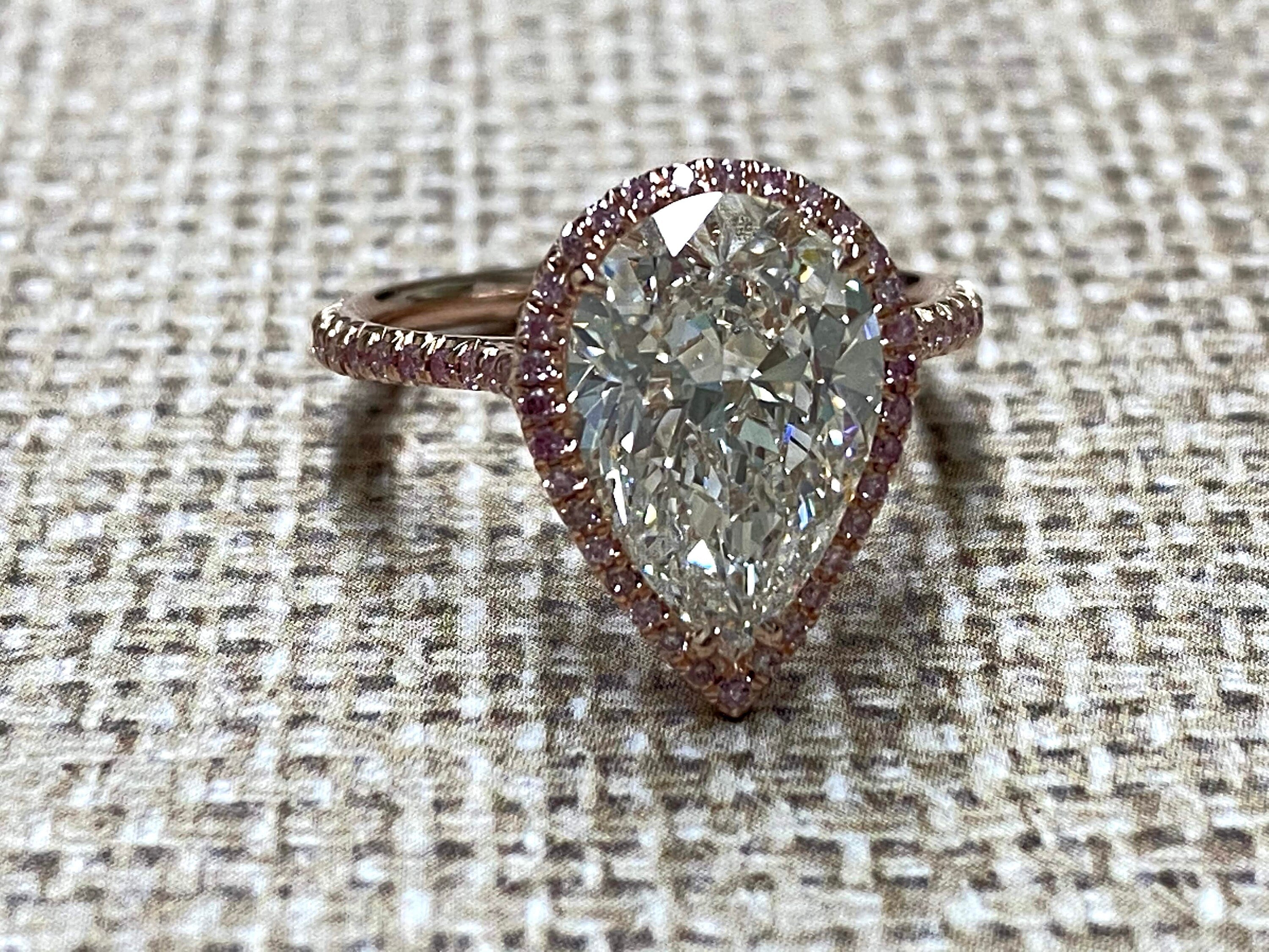 Rose Gold pearshape diamond center ring