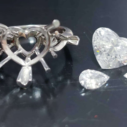 Platinum handmade ring with heart shaped diamond center