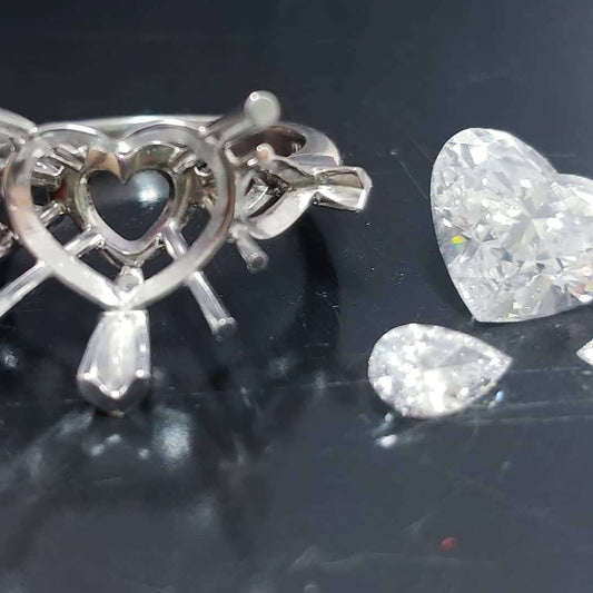 Platinum handmade ring with heart shaped diamond center