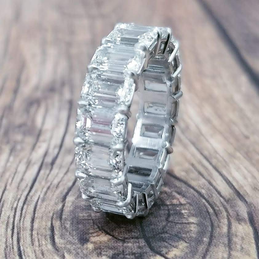 Platinum eternity band with emerald cut diamonds