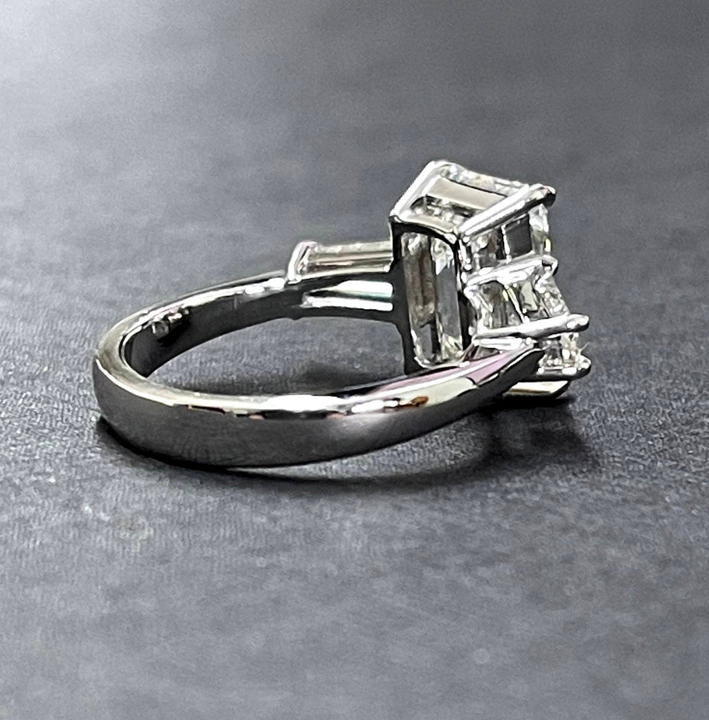 Platinum diamond center baguette sides ring
