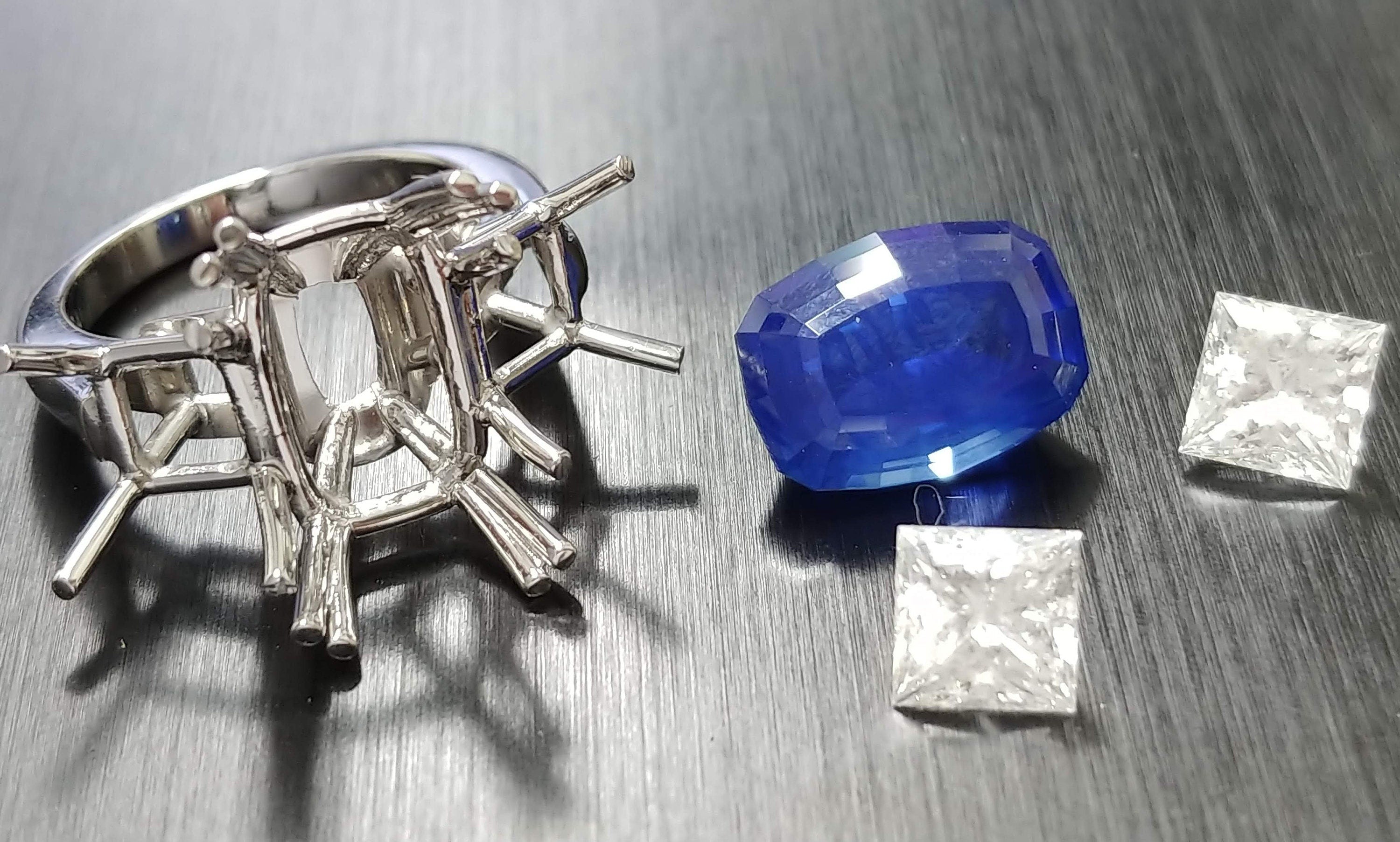 Platinum handmade ring, Cushion sapphire center with princess diamonds