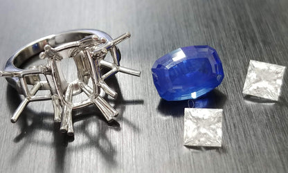 Platinum handmade ring, Cushion sapphire center with princess diamonds