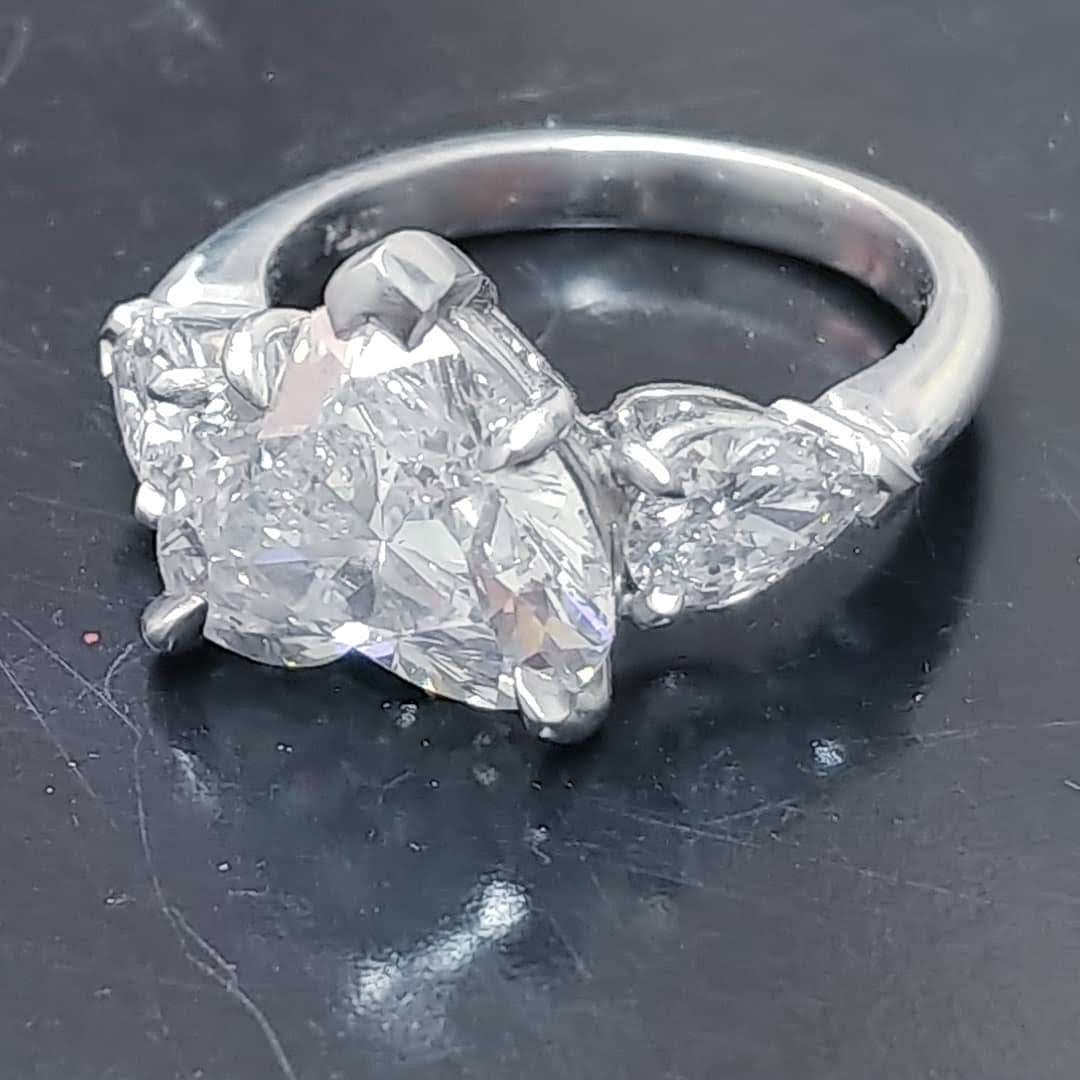 Platinum handmade ring with heart shaped diamond center