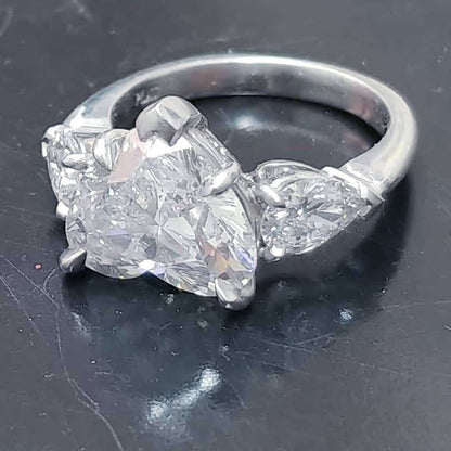 Platinum handmade ring with heart shaped diamond center