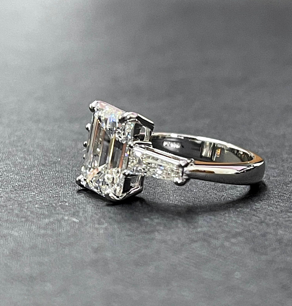 Platinum diamond center baguette sides ring