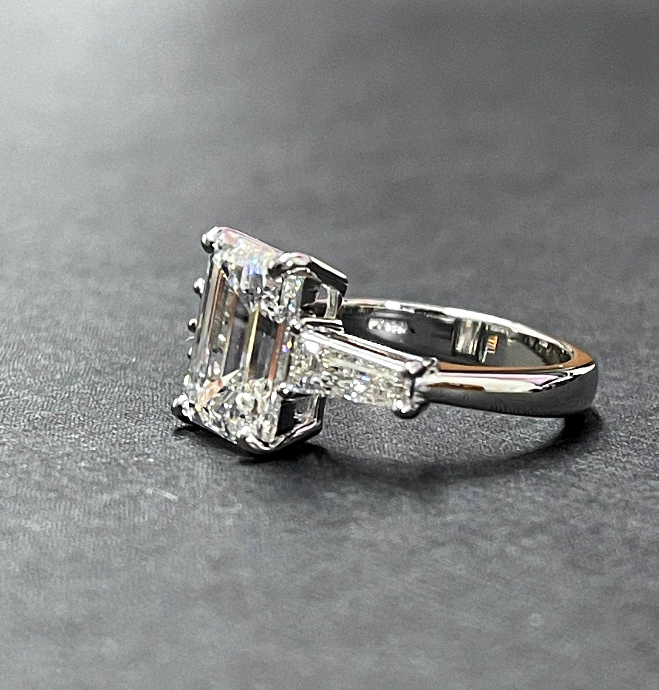 Platinum diamond center baguette sides ring