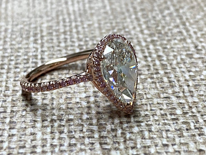 Rose Gold pearshape diamond center ring