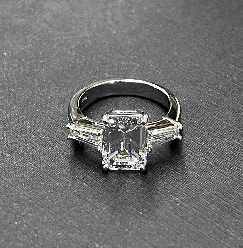 Platinum diamond center baguette sides ring