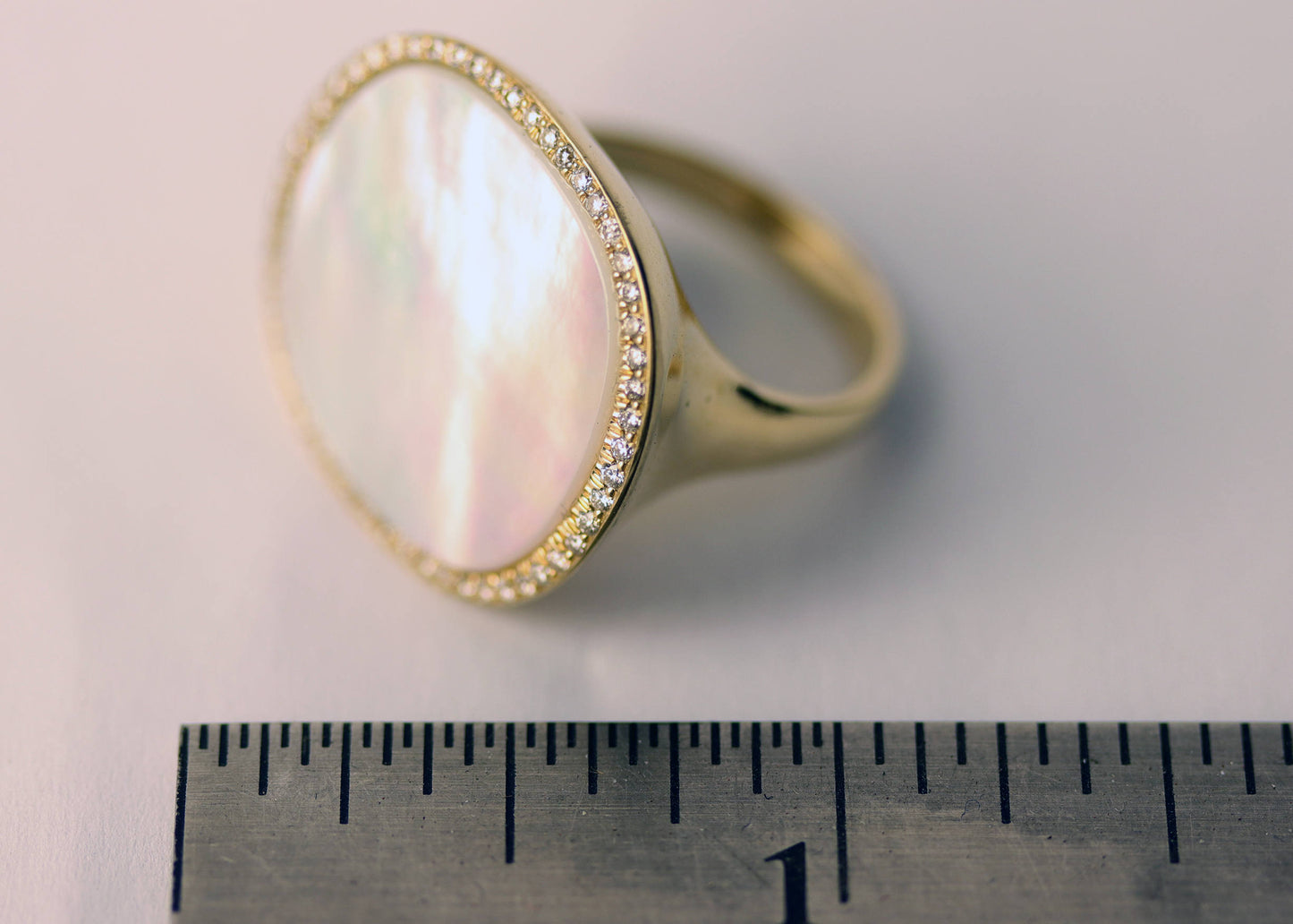 Yellow gold mother of pearl ring with 0.30ct tw diamonds, art deco