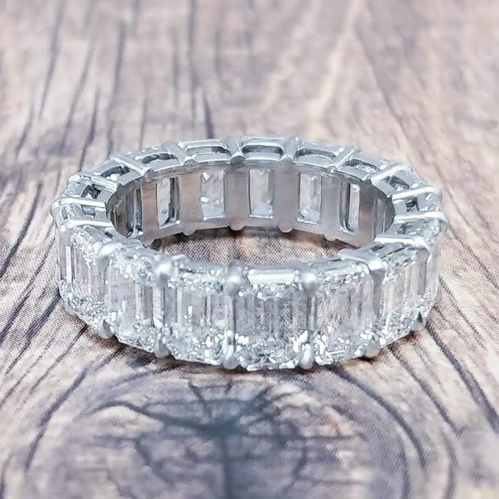 Platinum eternity band with emerald cut diamonds