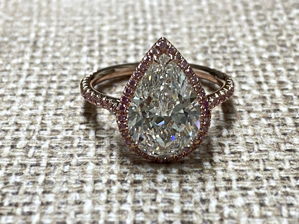 Rose Gold pearshape diamond center ring